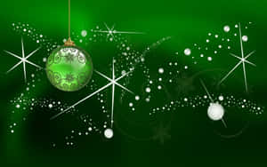 Christmas Ball On Glittering Dark Green Wallpaper