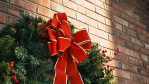Christmas Bow On Wreath Wallpaper