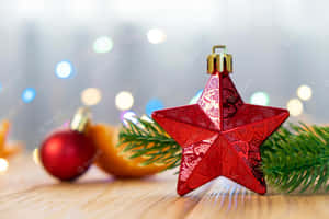 Christmas Decoration With Star On A Wooden Table Wallpaper