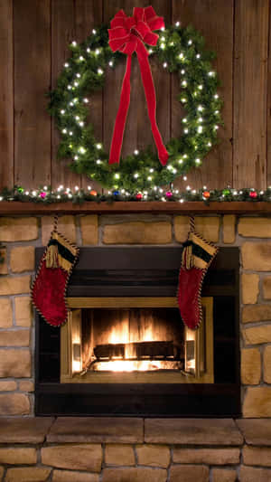 Christmas Fireplace With Wreathand Stockings.jpg Wallpaper