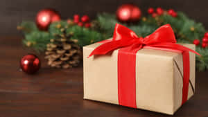 Christmas Gift With Red Ribbon Wallpaper