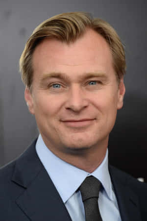 Christopher Nolan Posing For A Portrait Wallpaper