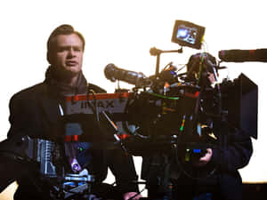 Christopher Nolan Standing On Set In An Intense Moment Wallpaper