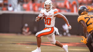 Chuba Hubbard Oklahoma State Football Action Wallpaper