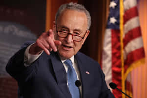 Chuck Schumer Speakingwith Gesture Wallpaper