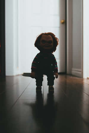 Chucky Doll Standing In The Hallway Wallpaper