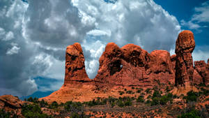 Chunky Clouds At Arches National Park Wallpaper