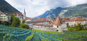 Chur Cityscapewith Vineyardsand Mountains Wallpaper