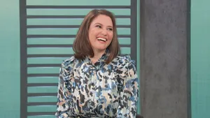 Chyler Leigh Posing In A Stylish White Dress Wallpaper