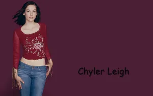 Chyler Leigh Smiling During A Photoshoot Wallpaper