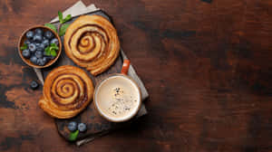 Cinnamon Rollswith Coffeeand Blueberries Wallpaper