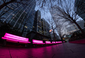 City Buildings With Neon Chairs Wallpaper