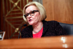 Claire Mccaskill Sophisticated In A Black Coat Wallpaper