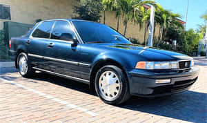 Classic Acura Vigor Sedan Parked Wallpaper