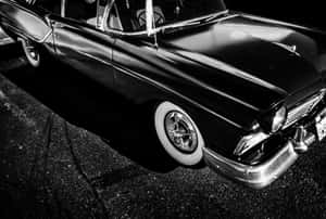 Classic Black And White Vintage Car On A Road Wallpaper