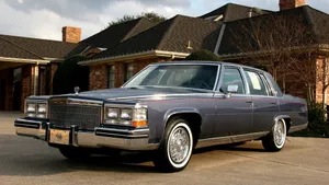 Classic Cadillac Fleetwood In A Vintage Garage Wallpaper