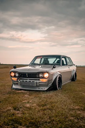 Classic Datsun 510 In Action Wallpaper