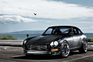 Classic Datsun Cruising Down The Road Wallpaper