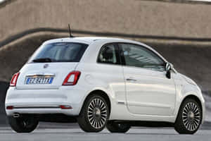 Classic Fiat 500 Riding In Style Wallpaper