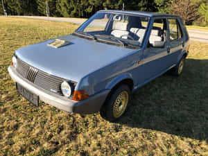Classic Fiat Ritmo Cruising On The Open Road Wallpaper