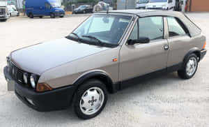 Classic Fiat Ritmo On Scenic Road Wallpaper