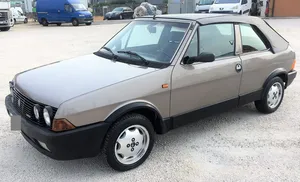 Classic Fiat Ritmo On Scenic Road Wallpaper