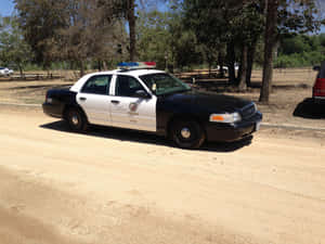 Classic Ford Crown Victoria On The Road Wallpaper