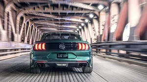 Classic Ford Mustang Bullitt Cruising In Style Wallpaper