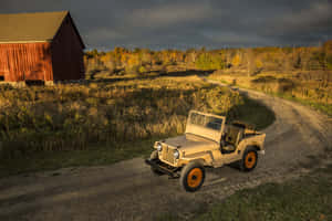 Classic Jeep Cj Off-roading Through Rugged Terrain Wallpaper