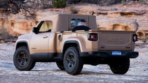 Classic Jeep Comanche Conquering Off-road Terrain Wallpaper