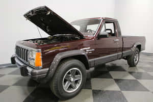 Classic Jeep Comanche Conquering Rugged Terrain Wallpaper