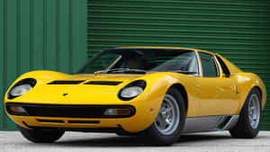 Classic Lamborghini Miura In Vibrant Yellow Wallpaper