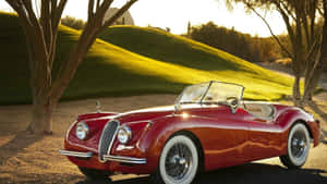 Classic Luxury - The Vivacious Jaguar Xk120 Wallpaper