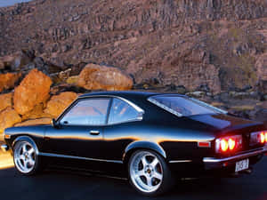 Classic Mazda Rx-3 In Action Wallpaper