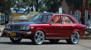 Classic Mazda Rx-3 In Its Sleek Design Glory Wallpaper