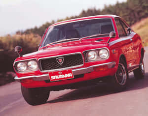 Classic Mazda Rx-3 In Stunning Action Shot Wallpaper