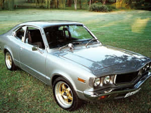 Classic Mazda Rx-3 On The Road Wallpaper