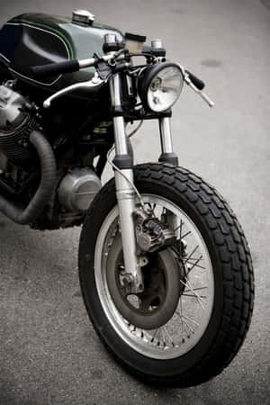 Classic Moto Guzzi Motorcycle On A Breathtaking Journey Wallpaper