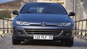 Classic Peugeot 406 Sedan In Bright Sunlight Wallpaper