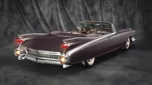 Classic Red Cadillac Eldorado In Nature Wallpaper