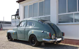 Classic Volvo Pv544 Parked Outdoors Wallpaper