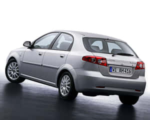 Classy Daewoo Lacetti In A Mesmerizing City Lights Atmosphere Wallpaper