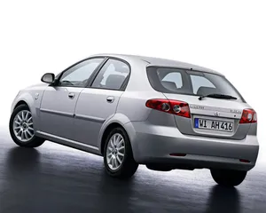 Classy Daewoo Lacetti In A Mesmerizing City Lights Atmosphere Wallpaper