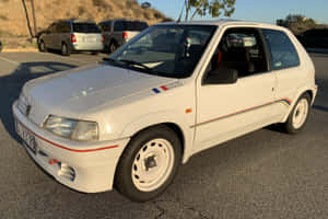 Classy Peugeot 106 In The Spotlight Wallpaper