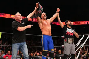 Claudio Castagnoli Hands Raised By Wheeler Yuta Wallpaper