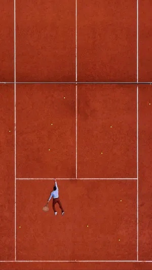 Clay Court Tennis Player Aerial View.jpg Wallpaper