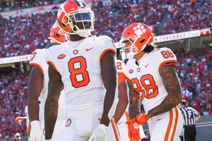 Clemson Football Players On Field Wallpaper