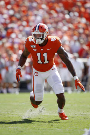 Clemson Linebacker Isaiah Simmons Action Shot Wallpaper