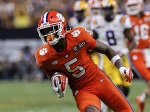 Clemson Player Number5 Running With Football2020 Wallpaper