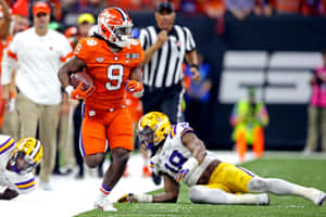 Clemson Running Back Evades Tackle Wallpaper